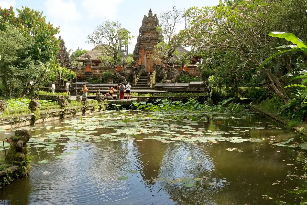 Lotus pond and ornamental temple gate at Pura Taman Saraswati in Ubud.